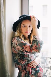 hipster model in floral outfit posing